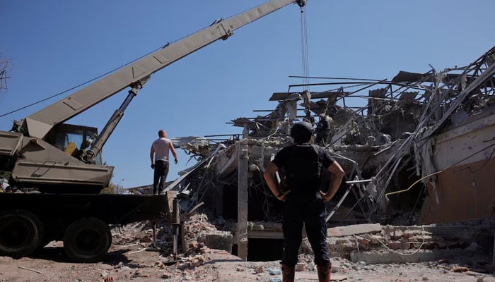 People stand near the rubble of a destroyed hotel following a Russian strike, amid the Russian invasion of Ukraine, in the town of Kramatorsk, Ukraine on August 25, 2024. — Reuters