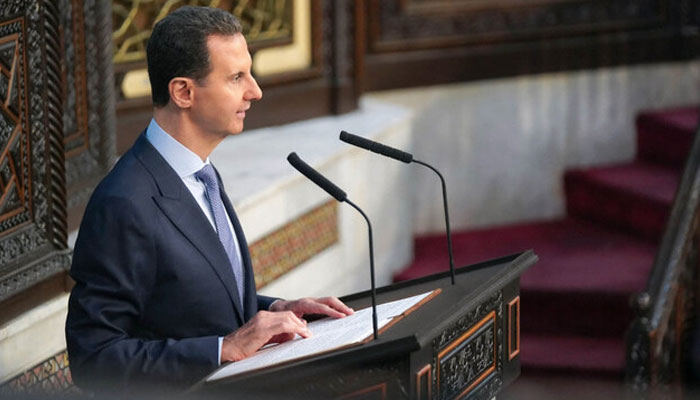 A handout picture released by the official Syrian Arab News Agency (SANA) on August 25, 2024, shows Syrian President Bashar Al-Assad addressing the countrys parliament in Damascus as it opens a new legislative term. — AFP