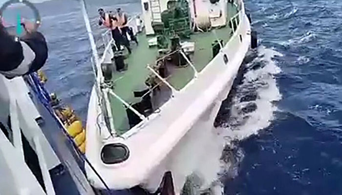 Screengrab from Philippine Coast Guard video of a Chinese Coast Guard ship colliding with the Philippine Bureau of Fisheries and Aquatic Resources vessel BRP Datu Sanday. — AFP