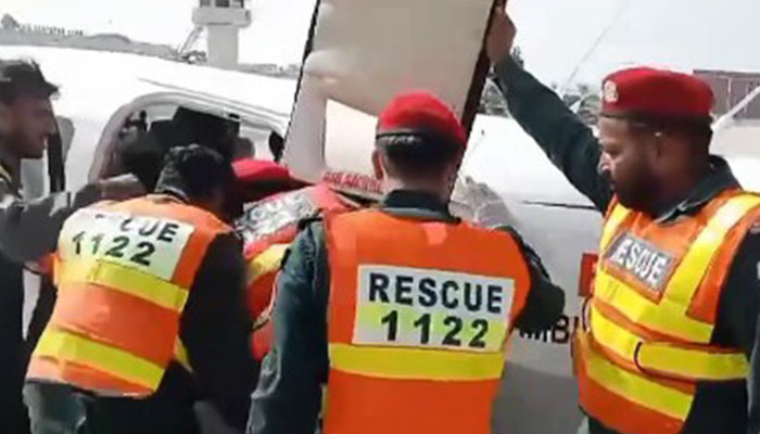 In this screengrab, rescue officials shift an injured policeman to an air ambulance on August 25, 2024. — Facebook/Maryam Nawaz Sharif