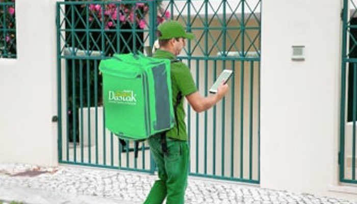 This representational image shows a delivery boy carrying “Maryam Ki Dastak” bag reaches at a house. — dastak website