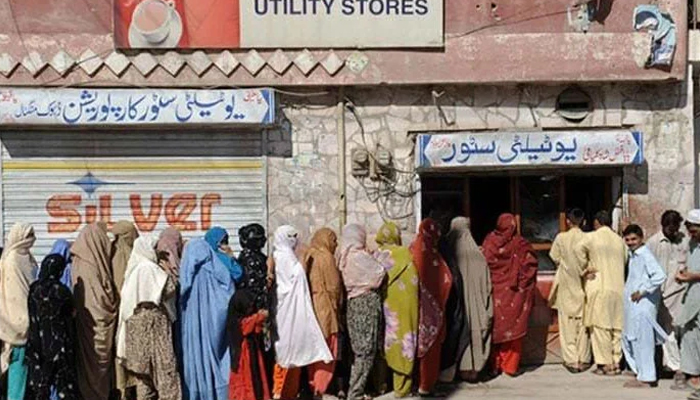 A long queue of people is seen outside a utility store in an undated picture. — AFP/File