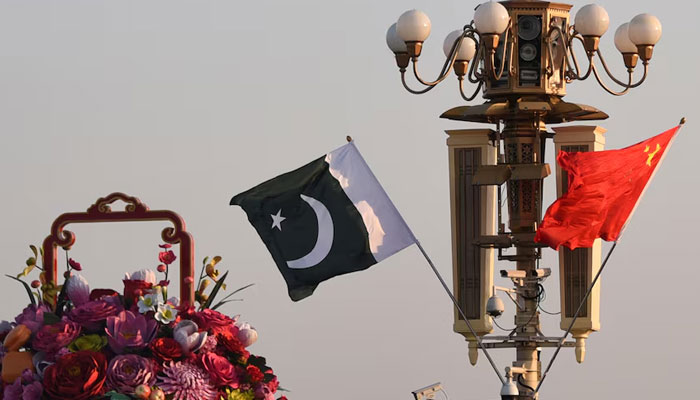 A representational image showing Pakistani and Chinese flags flutter next to an installation featuring a giant flower basket at the Tiananmen Square in Beijing, China. — Reuters/File