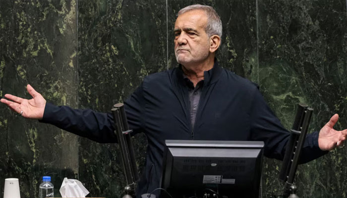 Irans President Masoud Pezeshkian addresses parliament during a session to approve his new cabinet appointments in Tehran, Aug, 21, 2024.— AFP