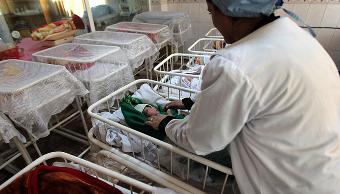 This representational image shows a staffer checking a new born baby at a hospital.— AFP/File