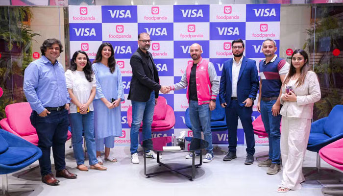 An image from the signing of the contract between Foodpanda and Visa.— Facebook@Foodpanda/file