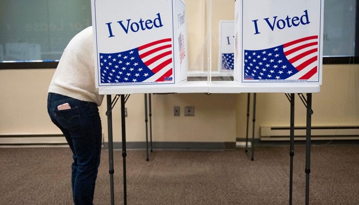 A representational image showing a person casting his vote during US elections. — AFP/File