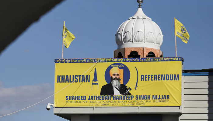 A banner with the image of Sikh leader Hardeep Singh Nijjar is seen at the Guru Nanak Sikh Gurdwara temple, site of his June 2023 killing, in Surrey, BC, on September 20, 2023.— Reuters