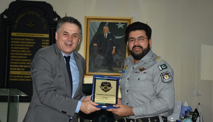 Senior Superintendent of Police (SSP) Traffic Muhammad Sarfraz Virk is giving shield to Argentine Ambassador Sebastián Sayús seen in this image released on August 28, 2024. — Facebook/@islamabadpolice