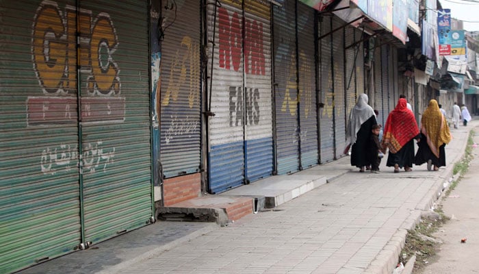 A view of closed shops as due to strike called by business community against rising sales and advance taxes, inflated electricity bills and the FBRs fixed tax policy, at Pipal Mandi in Peshawar on August 28, 2024. — PPI