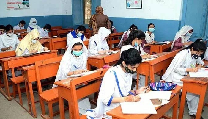 Students attempting an exam in a classroom in this undated photo. — APP/File