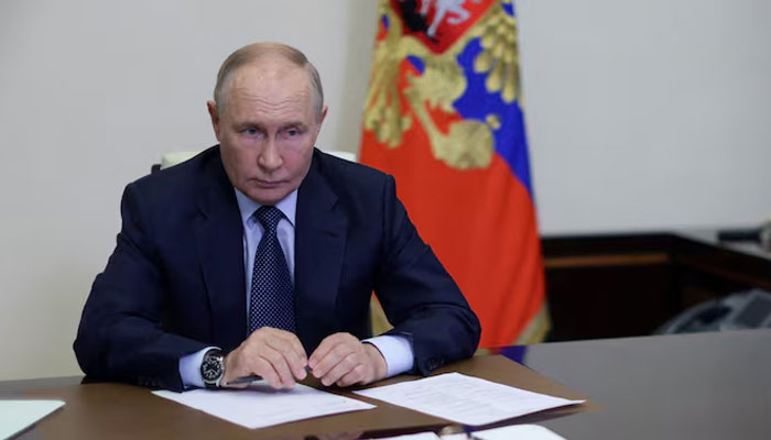 Russian President Vladimir Putin chairs a meeting on the situation in Belgorod, Kursk and Bryansk regions on August 22, 2024. — Reuters