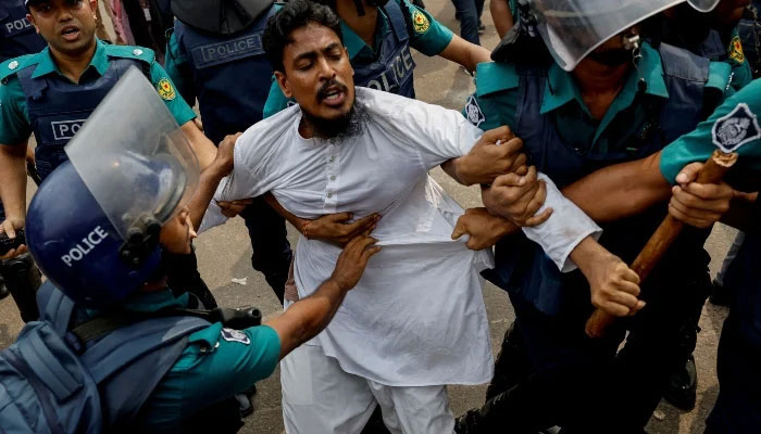 Police detains a man from the University of Dhaka premises, a day after the clash between Bangladesh Chhatra League, the student wing of the ruling party Bangladesh Awami League, and anti-quota protesters, in Dhaka, Bangladesh, on July 17, 2024. —Reuters