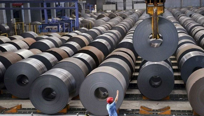 A representational image showing a steel manufacturing plant floor with stocked metal sheet rolls. — AFP/File