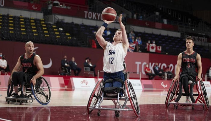 Britains Gregg Warburton (centre) seen during wheelchair basketball tournament at the Paris Paralympics . — ParalympicsGB