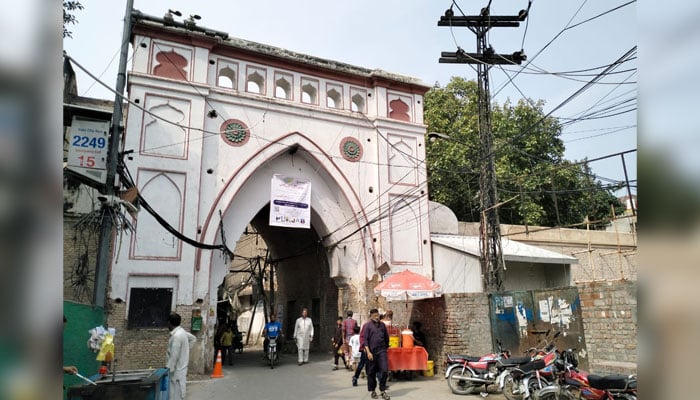 In this image, people pass through the Bhatti Gate on July 24, 2024. — Facebook/Walled City Lahore Authority