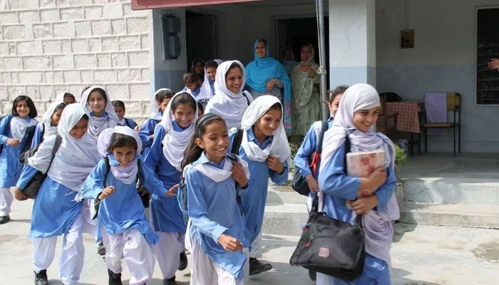 Schoolgirls rush outside their class in an undated picture. — INP