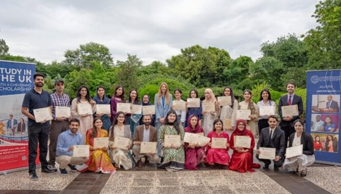 Pakistani students pictured along with British High Commissioner Jane Marriott. — APP via British High Commission/File