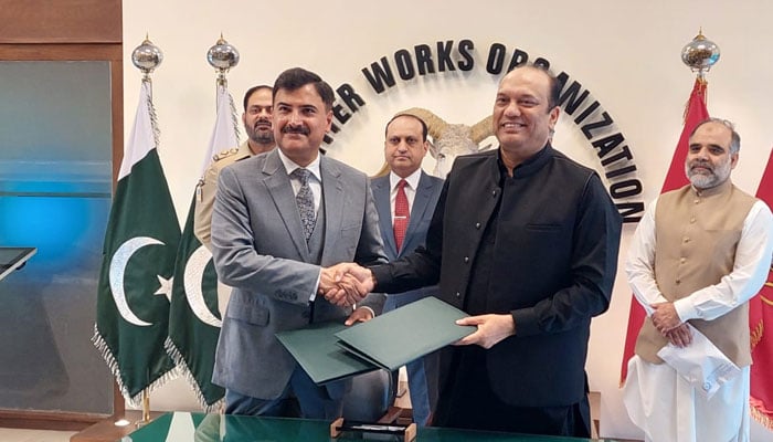 HSA Vice Chancellor Professor Shahzad Ali Khan (right) and FWO DG Major General Abdul Sami shake hands after signing an MoU. — Supplied/File