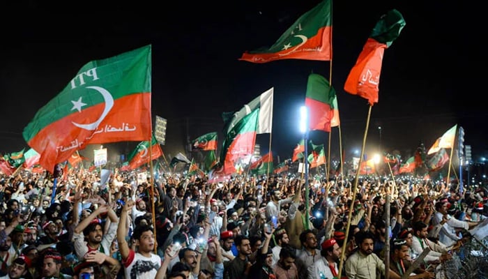 PTI workers at a public gathering in this undated picture. — AFP/File