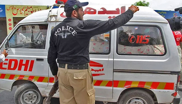 This undated image shows an Edhi ambulance with police personnel making a way. — AFP/File