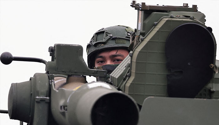 A soldier stands on an M1167 TOW carrier vehicle at the Fangshan training grounds in Pingtung, Taiwan, August 26, 2024. — Reuters