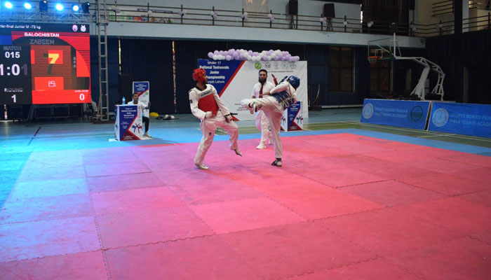 This undated photo shows two contestants fight during the National Under-17 Junior Taekwondo Championship in Lahore. — Facebook/ Directorate General Sports & Youth Affairs, Punjab