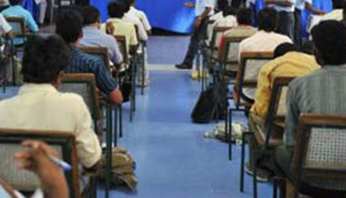 This representational image shows students taking a lecture in a class. — AFP/File