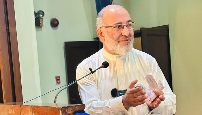 Former senator Mushtaq Ahmed speaks at an event on August 25, 2024. — Facebook/Mushtaq Ahmad Khan