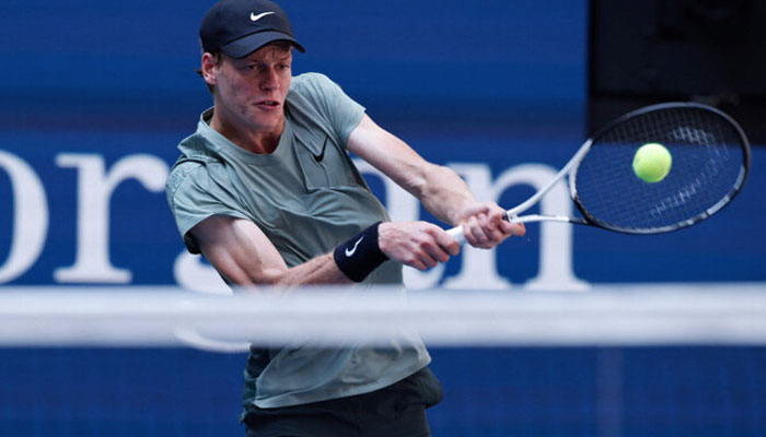 Italys Jannik Sinner plays a return to Australias Christopher OConnell during their mens singles third round match on day six of the US Open tennis tournament at the USTA Billie Jean King National Tennis Center in New York City, on August 31, 2024.  — AFP