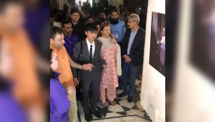 Secretary, Tourism, Archaeology and Museums Department Punjab, Farid Ahmad Tarar (left) viewing  photo exhibition titled ‘Wonders of Thailand.’ at Lahore Museum on September 1, 2024. — Screengrab via Facebook/Lahore Museum