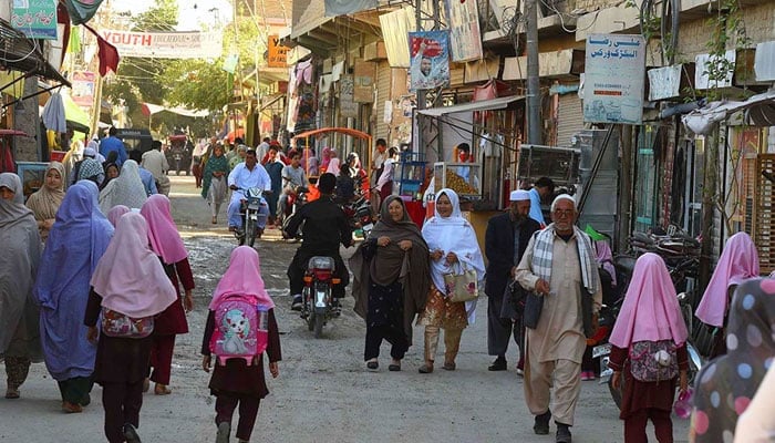 A representational image showing people walking in a street in Quetta, Balochistan. — AFP/File