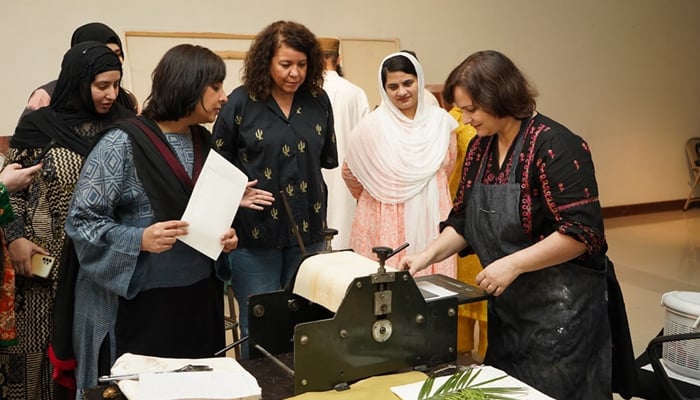 Participants watching Iram Wani PRINTING THE LAND: A Monotype Workshop organized by National Art Gallery, Pakistan National Council of the Arts (PNCA) image released on September 2, 2024. — Facebook/@PNCAOfficial