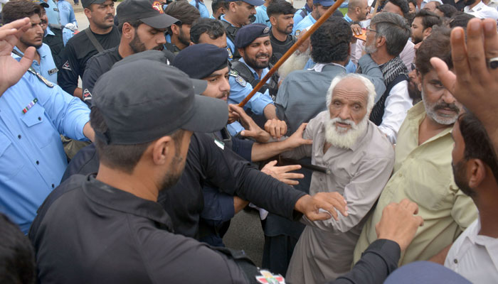 Policemen arrest protesters during a PWD employees protest in favour of their demands at Srinagar Highway in Islamabad on September 3, 2024. — Online