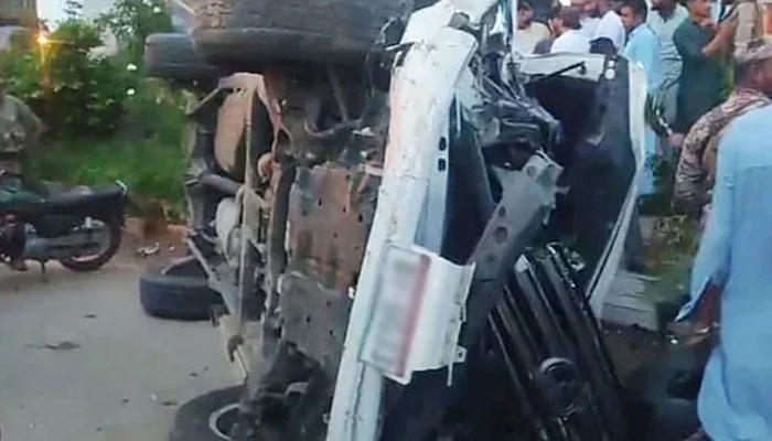 A damaged vehicle is lying upside down due to an accident on Karsaz Road in Karachi on August 19, 2024. — Reporter