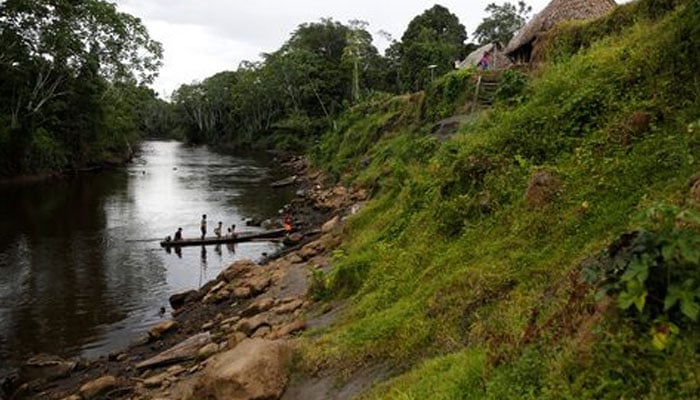 A representational image showing people are seen on a small boat in the Amazon rainforest in Santa Hermosa, Peru on October 12, 2021. —Reuters