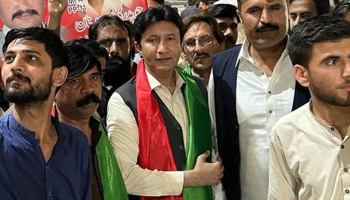 Former Member Punjab Assembly (MPA) Chaudhry Adnan (c) among his supporters during a party rally. — Facebook/Chaudhary Muhammad Adnan/File