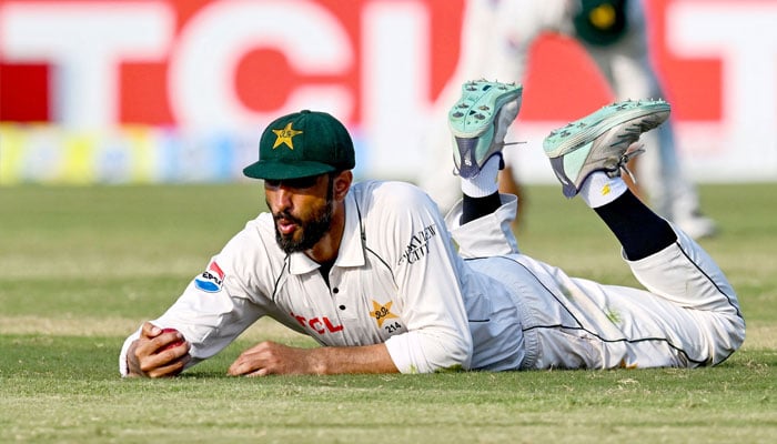 Pakistan´s captain Shan Masood reacts after dropping a catch of Bangladesh´s Hasan Mahmud (not pictured) during the third day of the second and last Test cricket match between Pakistan and Bangladesh, at the Rawalpindi Cricket Stadium in Rawalpindi on September 1, 2024.— AFP