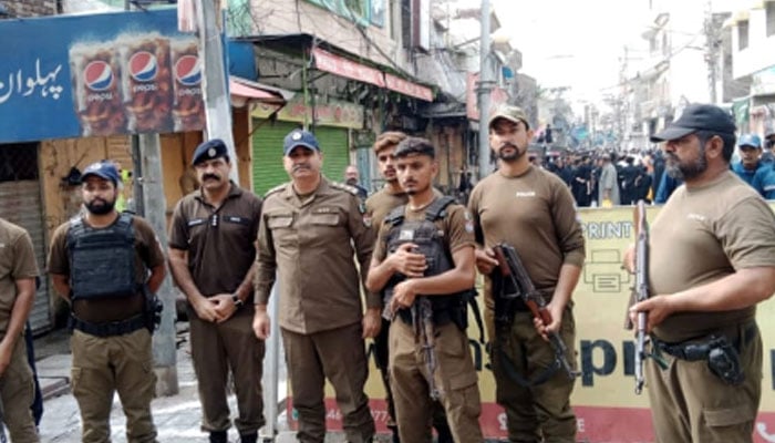 Punjab police personnel standing guard on the road on August 26, 2024. — Facebook/Punjab Police Pakistan