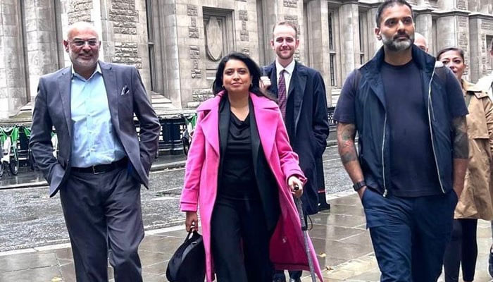 Journalist Saima Mohsin arriving in court with her counsel, Barrister Finnian Clarke, and others. — Reporter