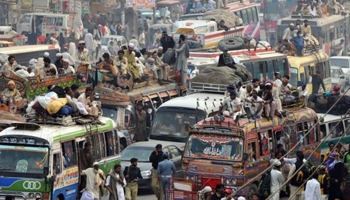 This representational image shows buses and other public transport vehicles filled with passengers. — AFP/File