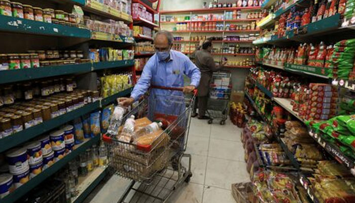 A person shops for grocery items at a store in Peshawar. — Reuters/File