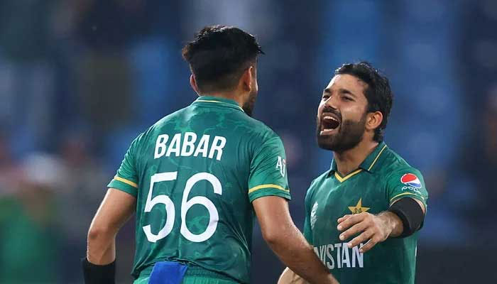 Pakistan batsmen Babar Azam (left) and Mohammad Rizwan move forward to hug in T20 World Cup 2021. — ICC