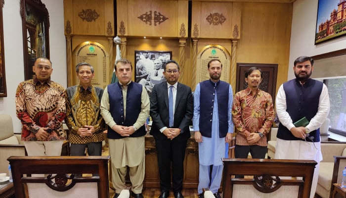 Peshawar Division Commissioner Riaz Khan Mahsud and Head of Political Affairs at the Indonesian Embassy Fery Geniwan Merdinsyah and others seen in this group photo released on September 6, 2024. — Facebook/@Commissioner Peshawar Division, Peshawar