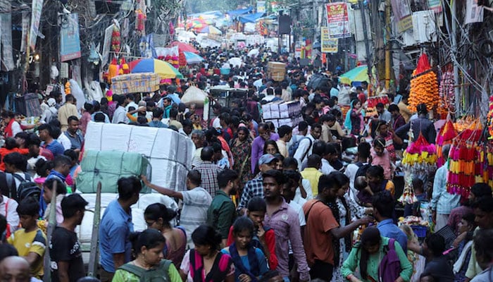 People shop at a crowded market ahead of Diwali, the Hindu festival of lights, in the old quarters of Delhi, India on October 11, 2022. — Reuters