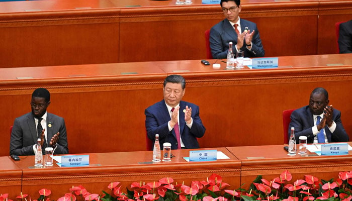 Chinas President Xi Jinping (C) applauds during the opening ceremony of the Forum on China-Africa Cooperation (FOCAC) in Beijings Great Hall of the People on September 5, 2024. — AFP