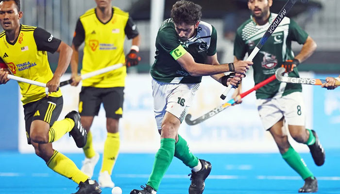 In this file photo, taken on January 18, 2024, Pakistan hockey team captain Ammad Butt plays a shot during a match against Malaysia in the Hockey Olympics Qualifier 2024 in Oman. — International Hockey Federation/File