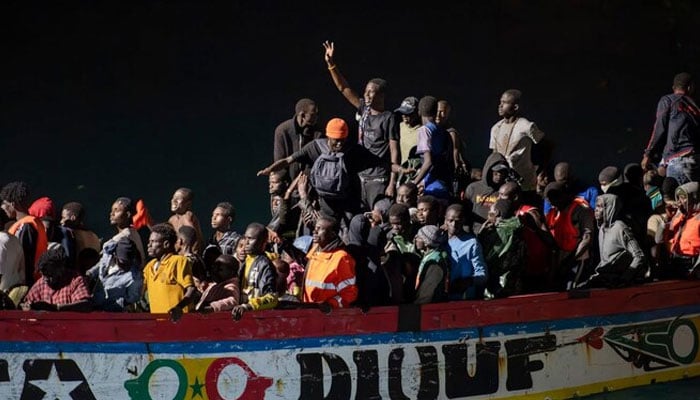 Migrants on a ‘cayuco’ boat arrive to disembark at La Restinga port on the Canary island of El Hierro, on September. 4, 2024. — AFP