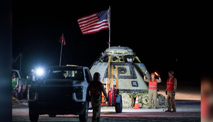 This picture courtesy of NASA taken on September 6, 2024, shows Boeing and NASA teams working around NASAs Boeing Crew Flight Test Starliner spacecraft after it landed uncrewed at White Sands, New Mexico. — AFP