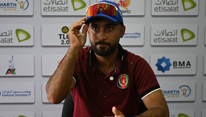 Afghanistans captain Hashmatullah Shahidi attends a press conference on the eve of their one-off Test cricket match against New Zealand at the Shaheed Vijay Singh Pathik Sports Complex in Greater Noida on September 8, 2024. — AFP